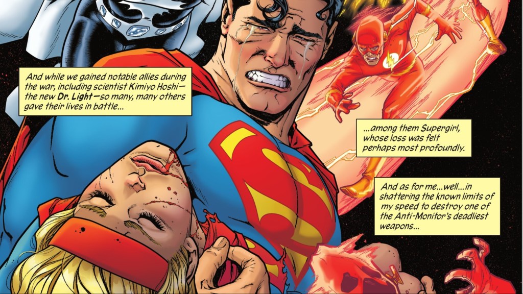 Superman holding the dead Supergirl while Barru Allen runs behind them