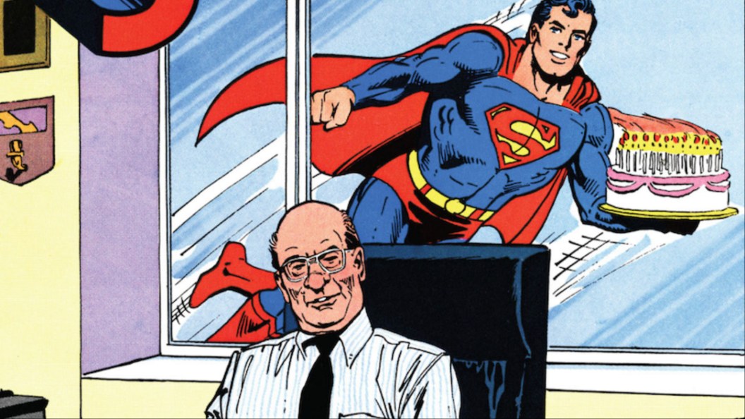 Superman with birthday cake flying behind DC editor Julius Schwartz