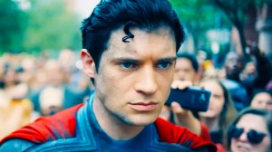 Superman walking through the crowd in 2025's Superman