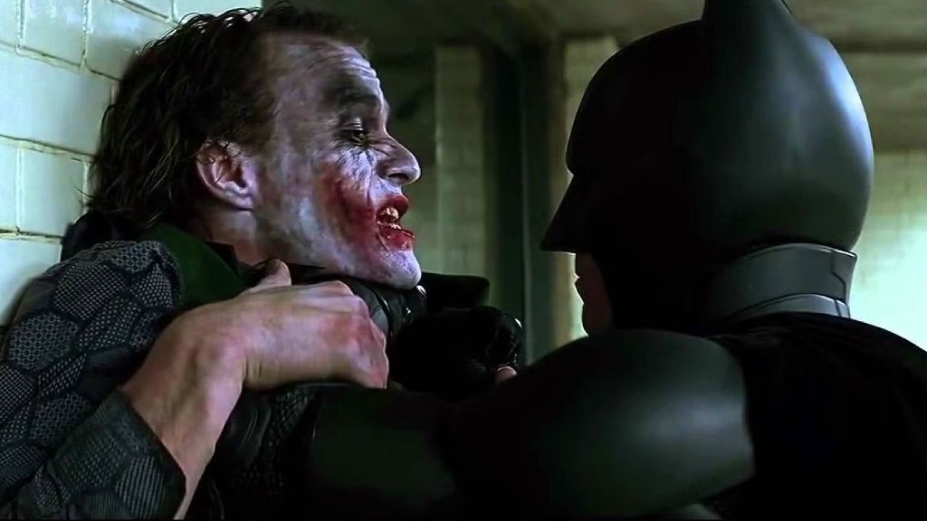 Heath Ledger's Joker being interrogated by Christian Bale's Batman in The Dark Knight (2008)