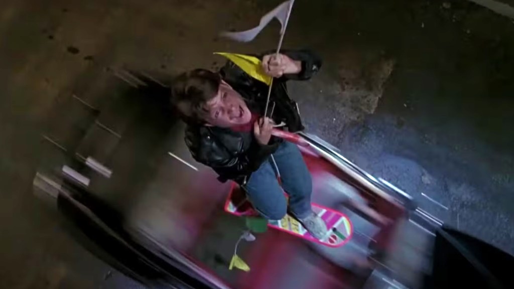 Marty McFly on a hoverboard being saved in Back to the Future Part II