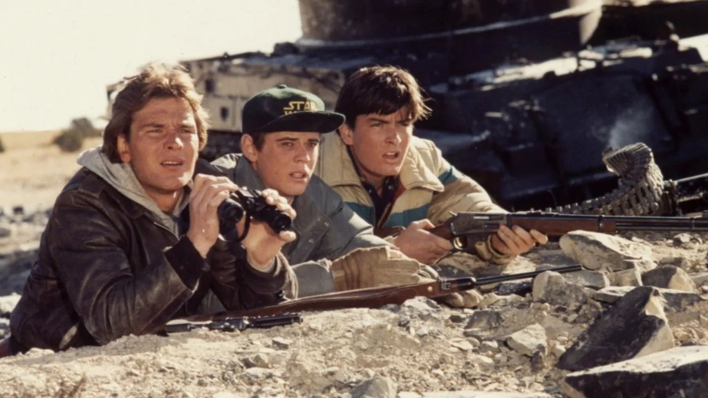 A still from Red Dawn (1984) showing teens with rifles