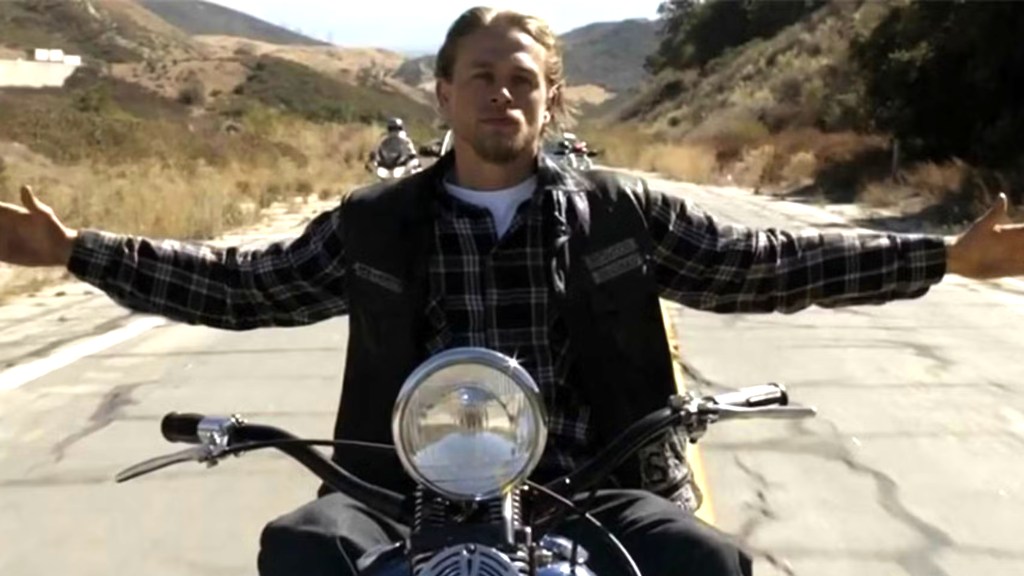 Jax Teller riding his bike with arms wide in the finale of Sons of Anarchy