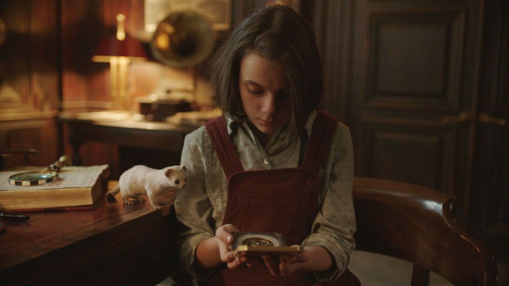 Lyra (Dafne Keen) and Pan in His Dark Materials