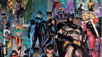 Batman and the Bat-Family standing on the Gotham rooftops