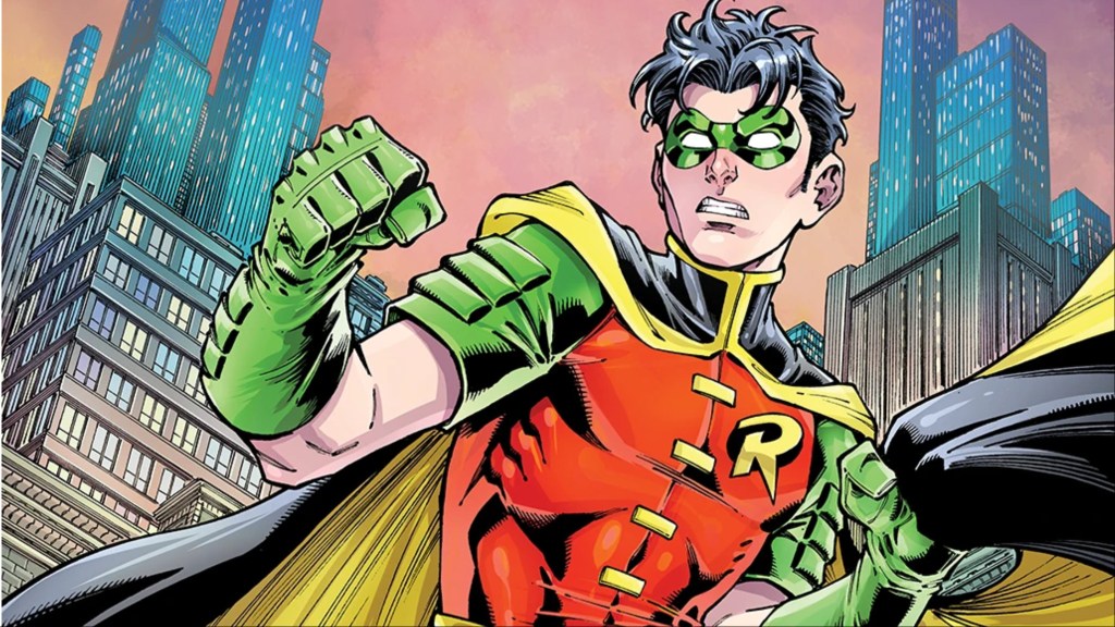 Tim Drake standing atop a building