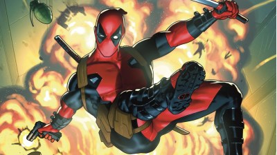Deadpool jumping away from an explosion while firing his gun behind him