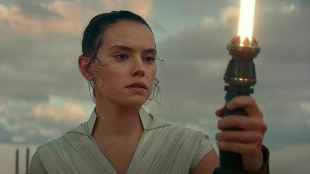 Rey with her yellow lightsaber in Star Wars The Rise of Skywalker