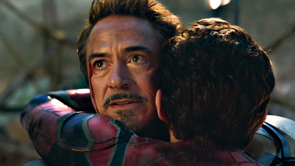 Spider-Man (Tom Holland) hugging Iron Man (Robert Downey Jr)