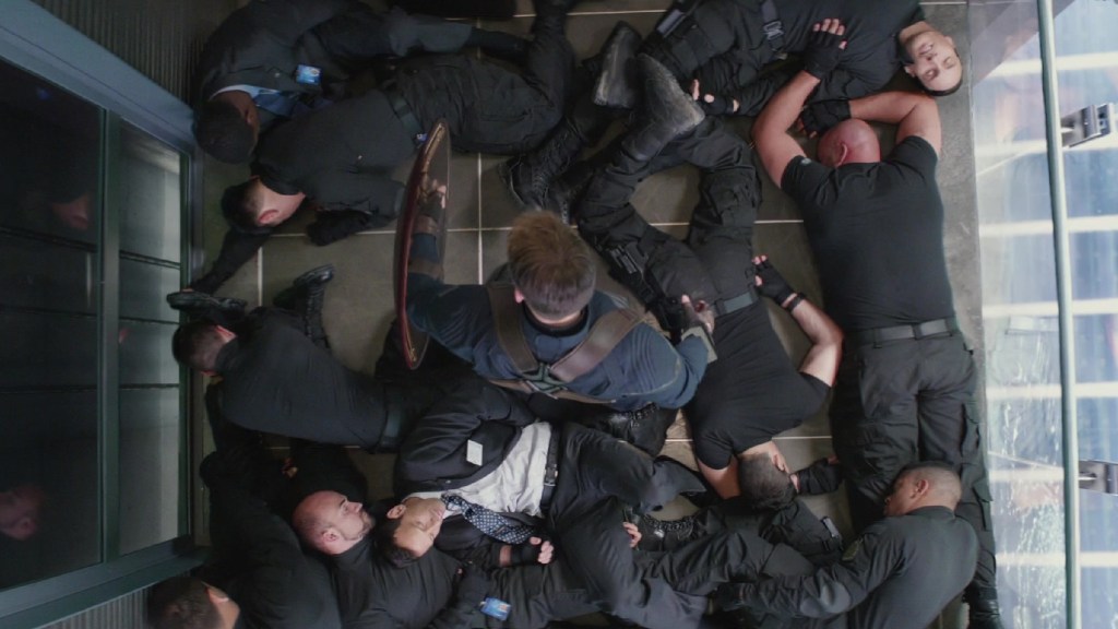Captain America standing over unconscious Hydra thugs in The Winter Soldier's elevator scene