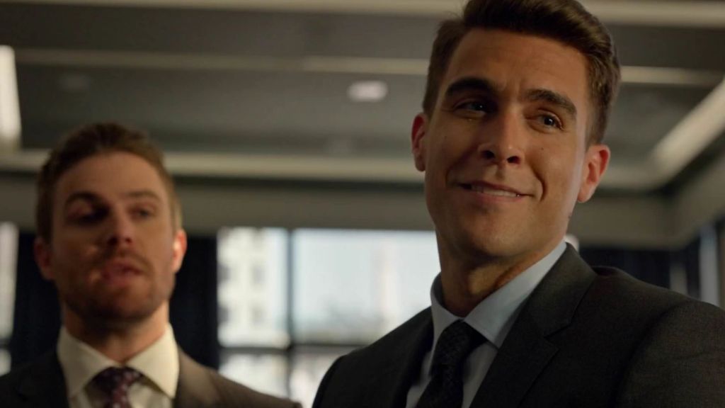Adrian Chase standing next to Oliver Queen in Arrow.