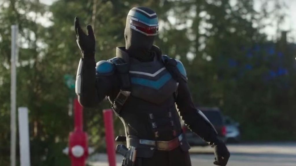 Vigilante waving his hand in Peacemaker.