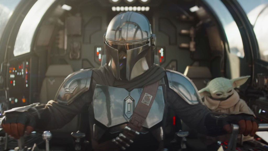 Din Djarin and Grogu in the Razor Crest in The Mandalorian and Grogu