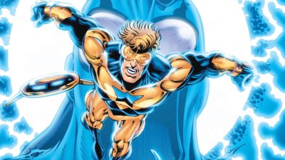 Booster Gold and Skeets flying through time with an empty Blue Beelte mask behind him