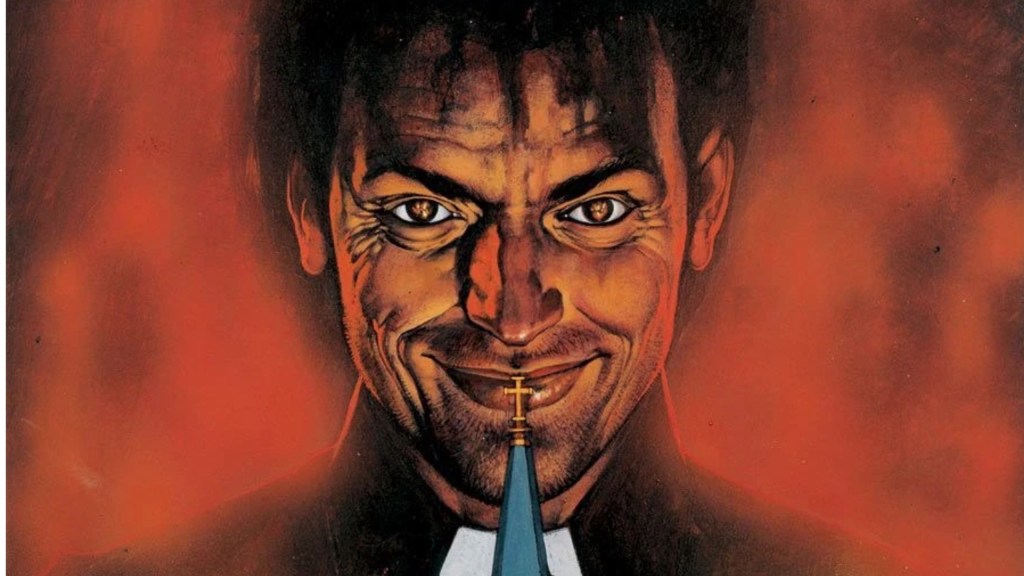 Jessie Custer smiling in front of a red sky, with a church steeple in front of him