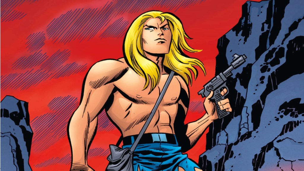 Kamandi standing under a red sky holding a gun