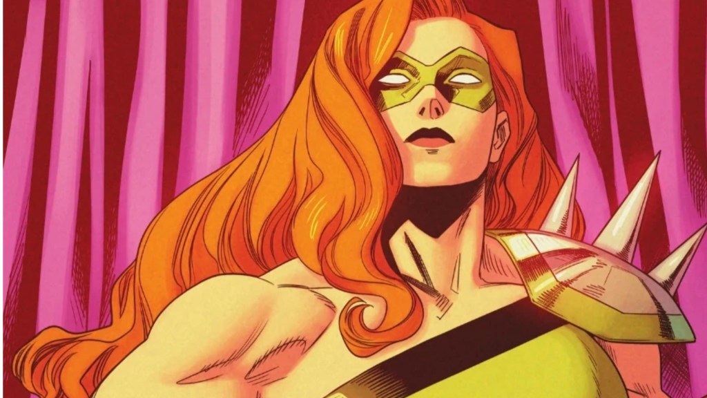 Knockout standing in front of a pink curtain