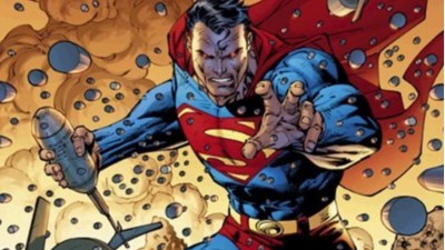Superman looking angry while holding an exploive, his eyes glowing, with bullets coming at him in midair.