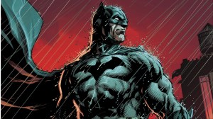 Batman in the rain, his cape billowing behind him, under a red sky