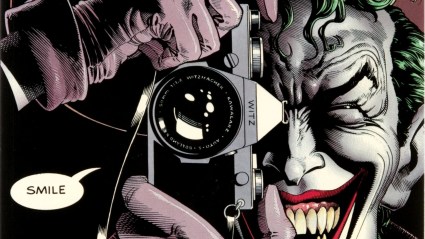 The Joker taking a picture with an old school camera