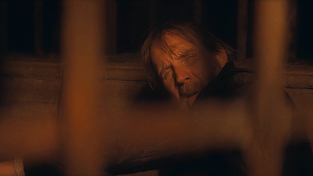 Otto Hightower (Rhys Ifans) in a prison cell in House of the Dragon Season 2