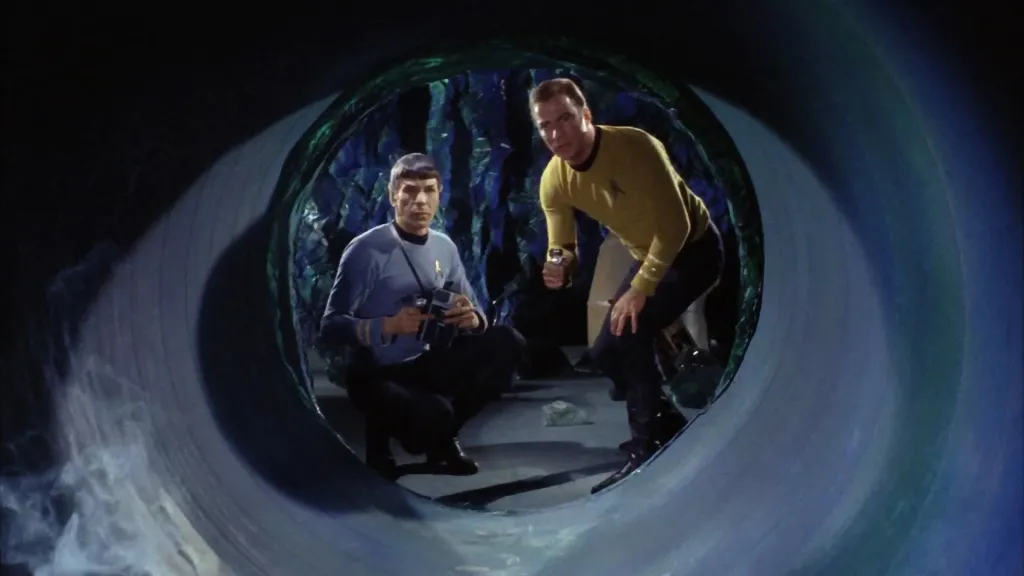 Spock and Kirk looking down a Horta hole in "Devil in the Dark"