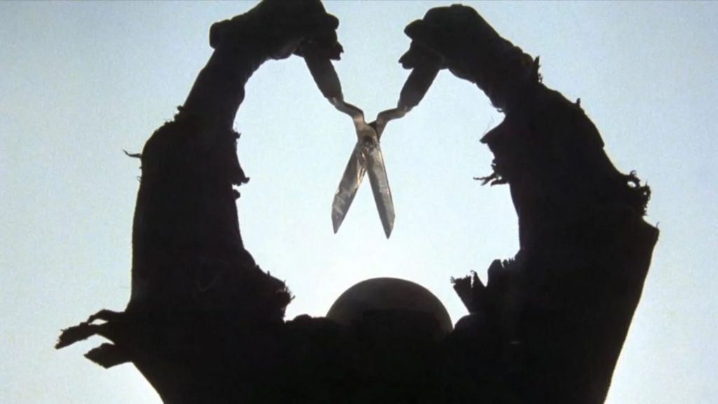 The killer raising scissors in The Burning