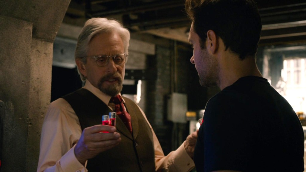 Michael Douglas as Hank Pym explaining Pym particles to Paul Rudd as Scott Lang in Ant-Man