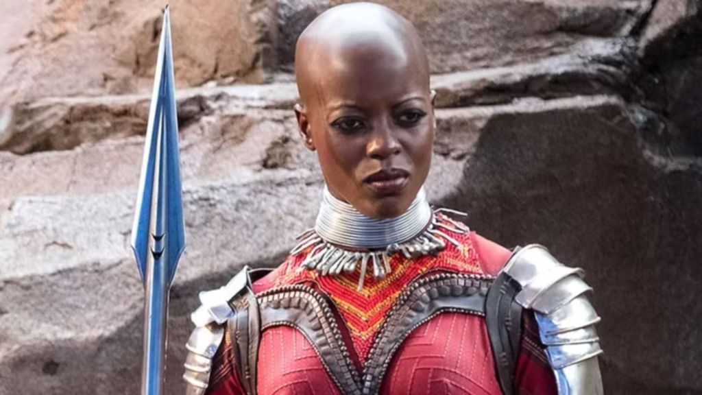 Ayo holding a spear.