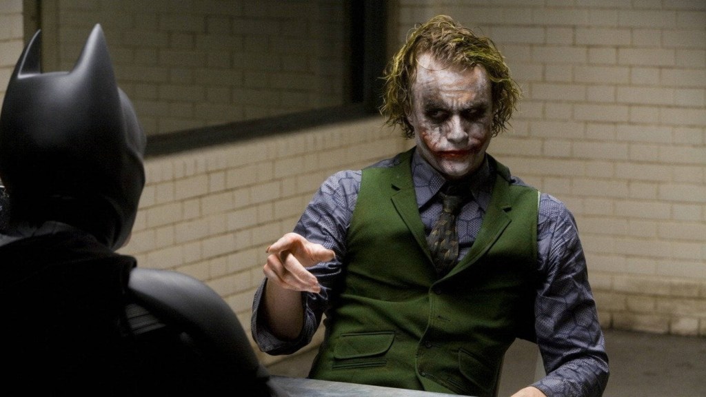 Christian Bale as Batman interrogating Heath Ledger as the Joker in The Dark Knight
