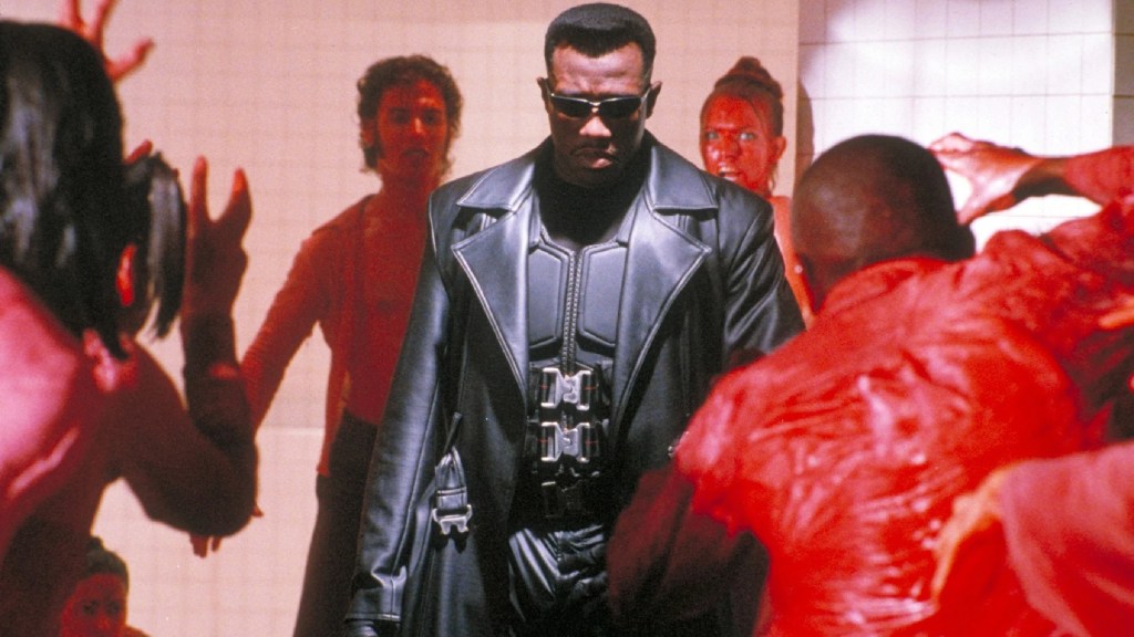 Wesley Snipes as Blade surrounded by vampires at the blood rave in Blade (1998)