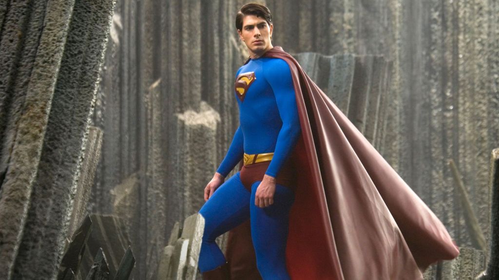 Superman with his cape waving.