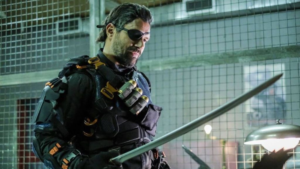 Slade Wilson holding a sword in Arrow.