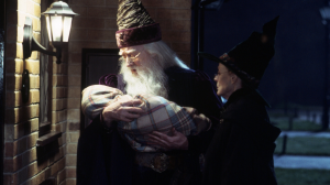 Dumbledore and McGonagall delivering baby Harry Potter to the Dursleys in The Philosopher's Stone