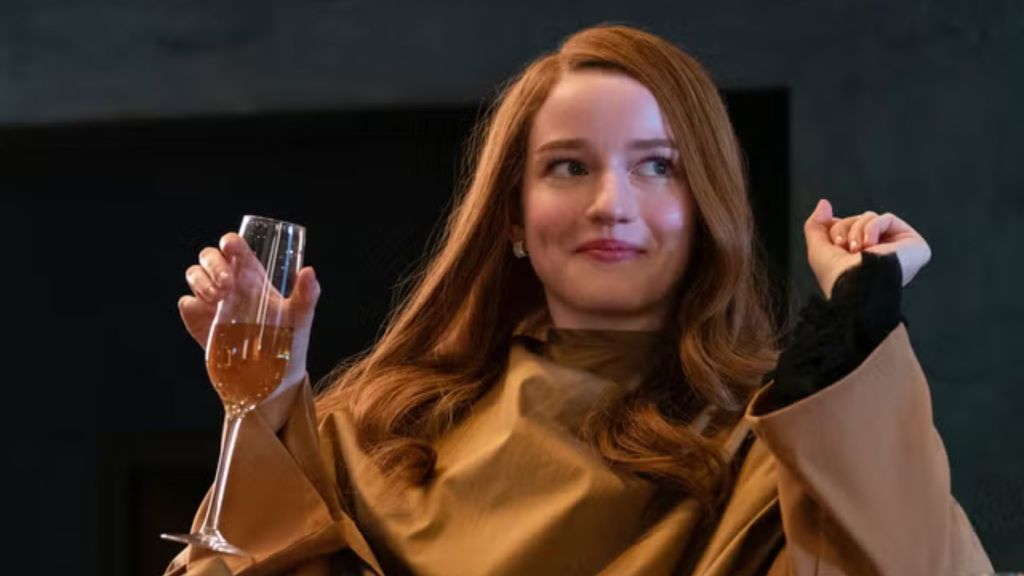 Anna holding a glass of wine and looking sophisticated.