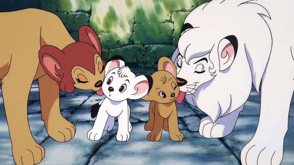 Jungle Emperor Leo white lion on the right and two lion cubs in the middle