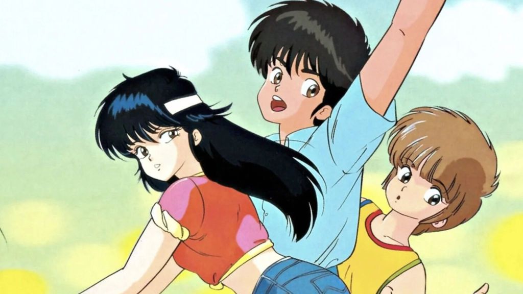 Kimagure Orange Road characters cycling together. The background is yellow