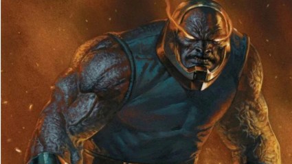 Darkseid, his eyes glowing with energy, looking monstrous