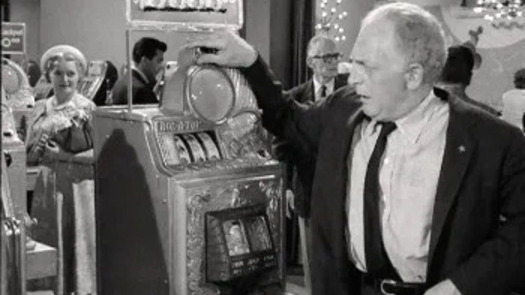 A man plays a special slot machine in "Fever" on The Twilight Zone