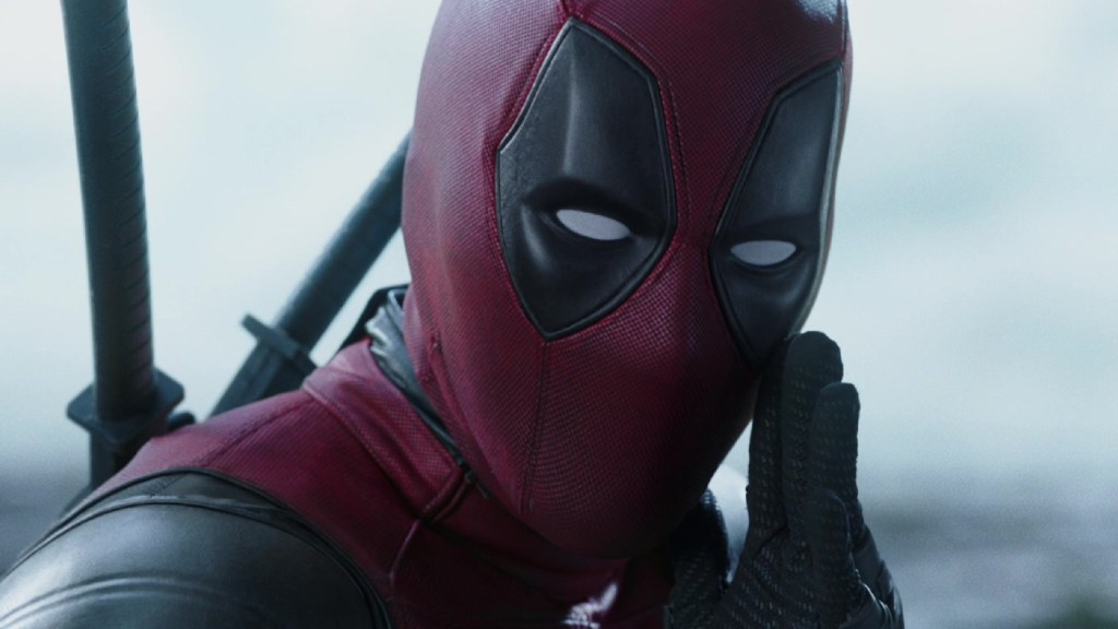 Ryan Reynolds as Deadpool speaking to the camera in Deadpool (2016)