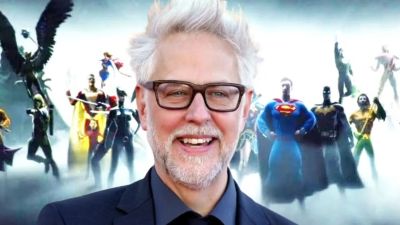 James Gunn in front of DC heroes.