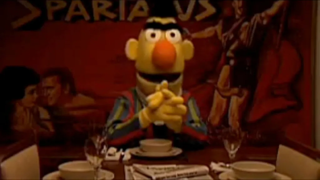 A Bert-like character sitting in a gay bar in Ernest and Bertram