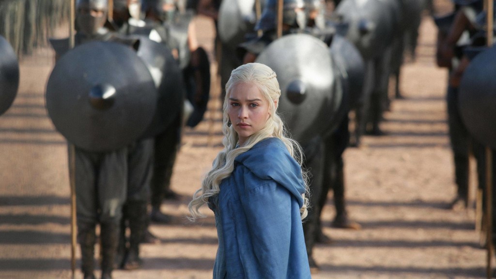 Emilia Clarke as Daenerys Targaryen standing before the Unsullied in Game of Thrones Season 3