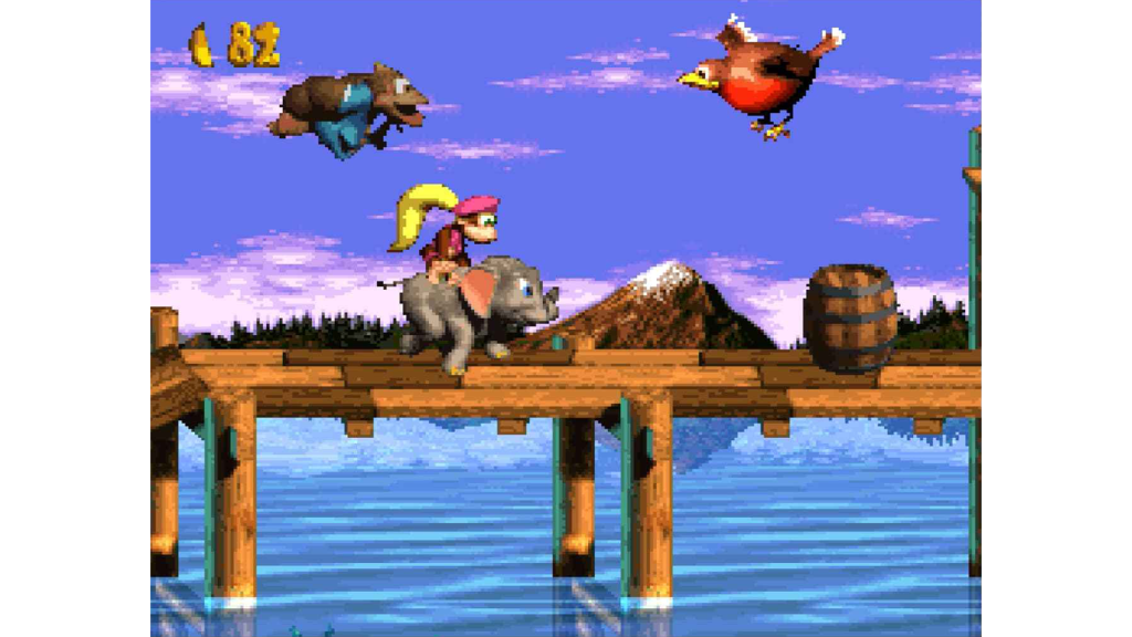 A screenshot from Donkey Kong Country 2: Diddy's Kong Quest, showing Diddy riding an elephant.