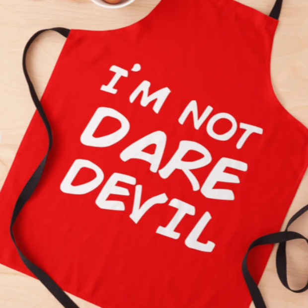 Red apron that says I'm Not Daredevil