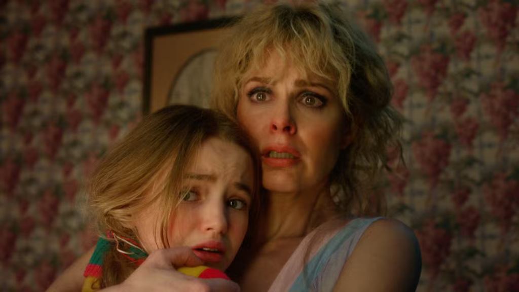 Holly and Karen Wheeler holding each other and looking scared in Stranger Things Season 5