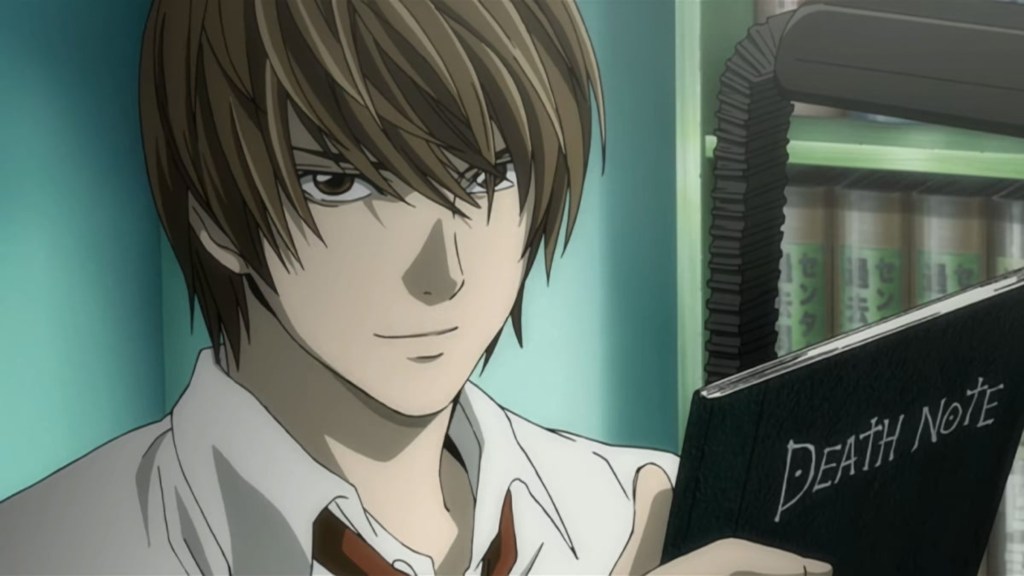 Light holding the Death Note and smiling in Death Note