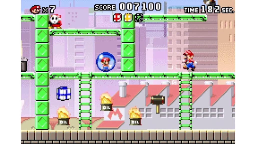 A screenshot from Mario vs. Donkey Kong, showing Mario navigate a level.