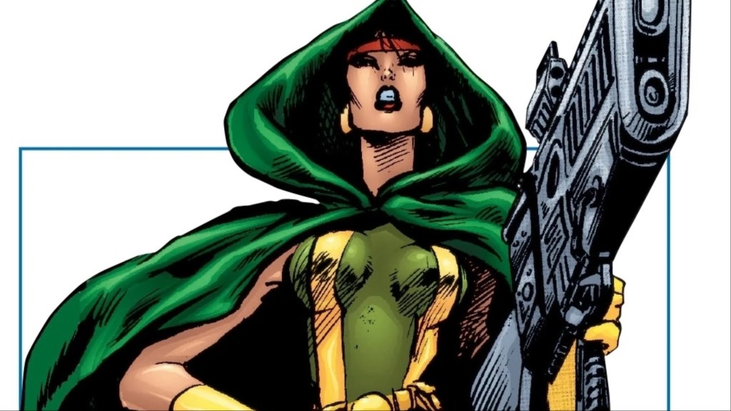 Silver Fox holding a '90s style gun while wearing a green cloak