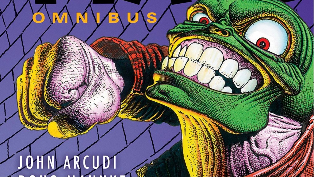 The Mask cocking back a fist for a punch